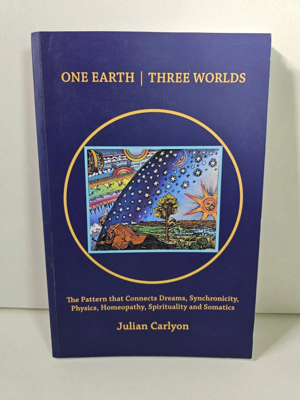 One Earth, Three Worlds by Julian Carlyon (2022)